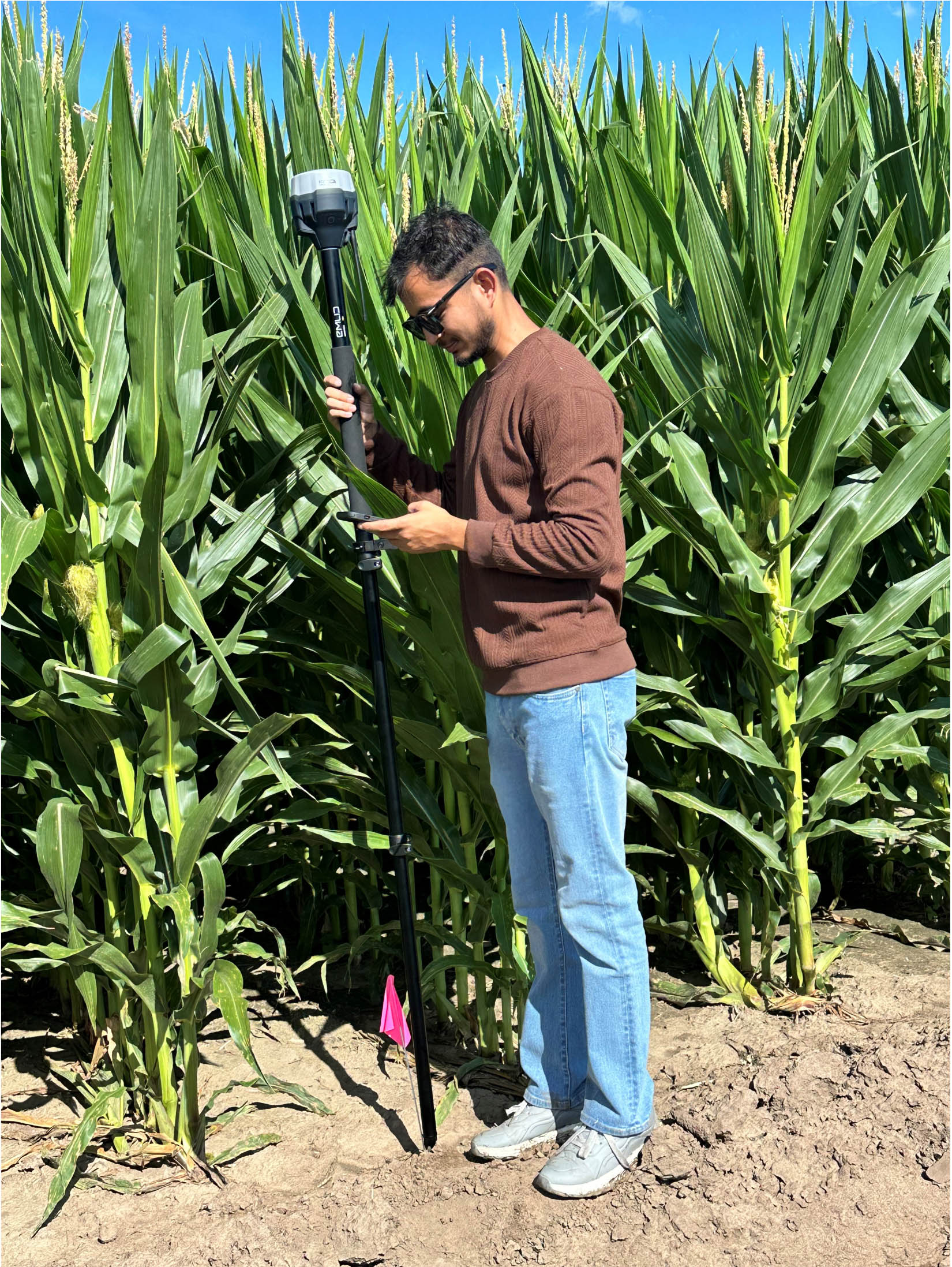 Sangam Bishwakarma collecting drone images and recording GPS location of the plots for his MS thesis work.