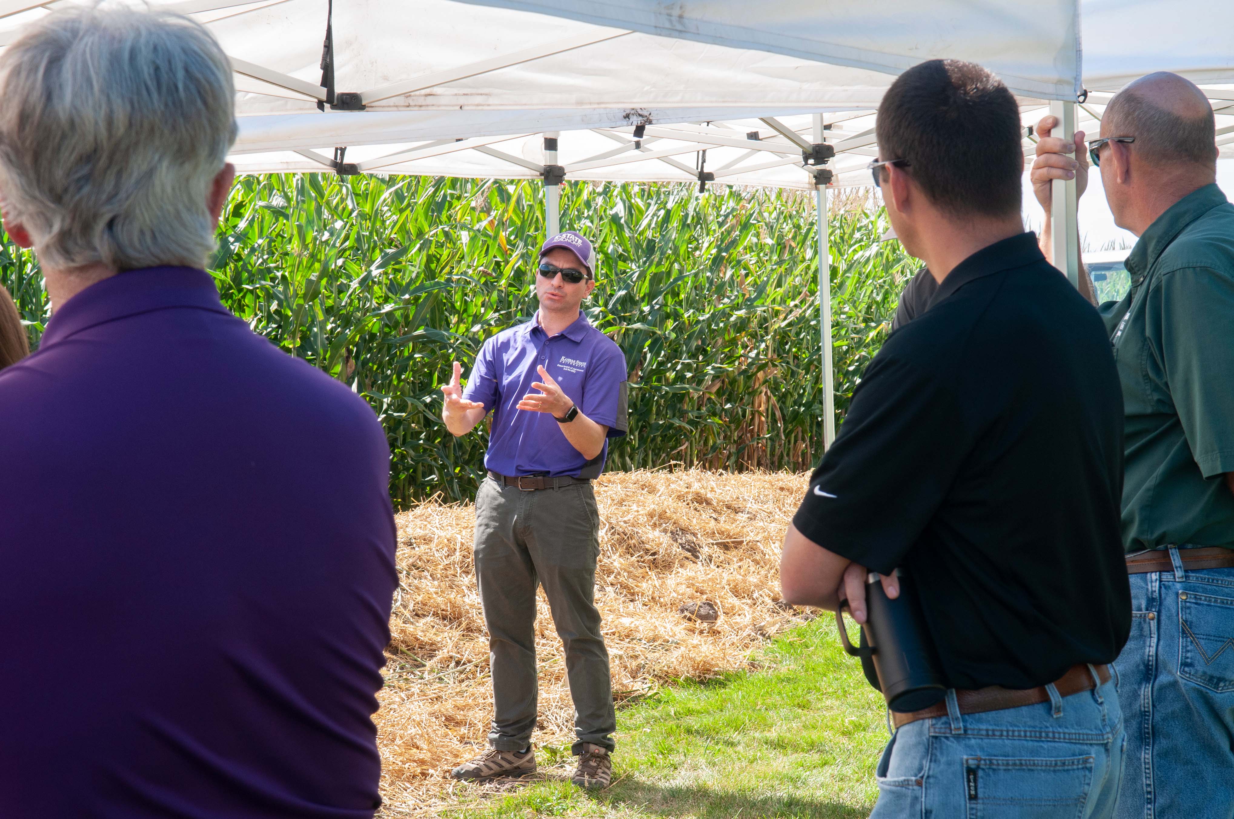 Faculty members speaking at Agronomy Field Days